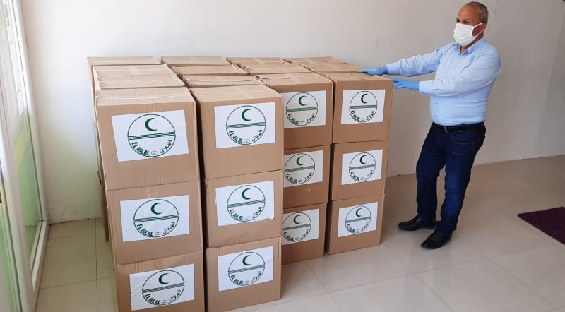 El Hilal 250 aileye yardım paketi dağıttı